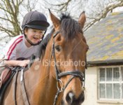 ist2_5850958-child-on-horse.jpg